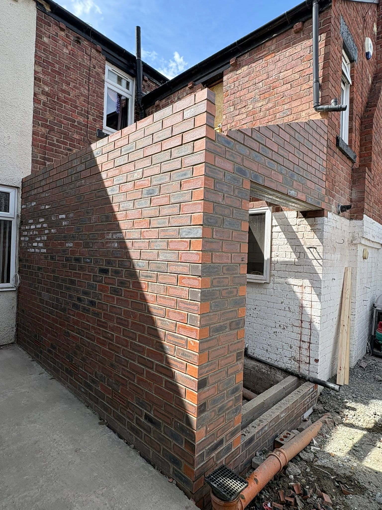 Brick extension structure taking shape on site