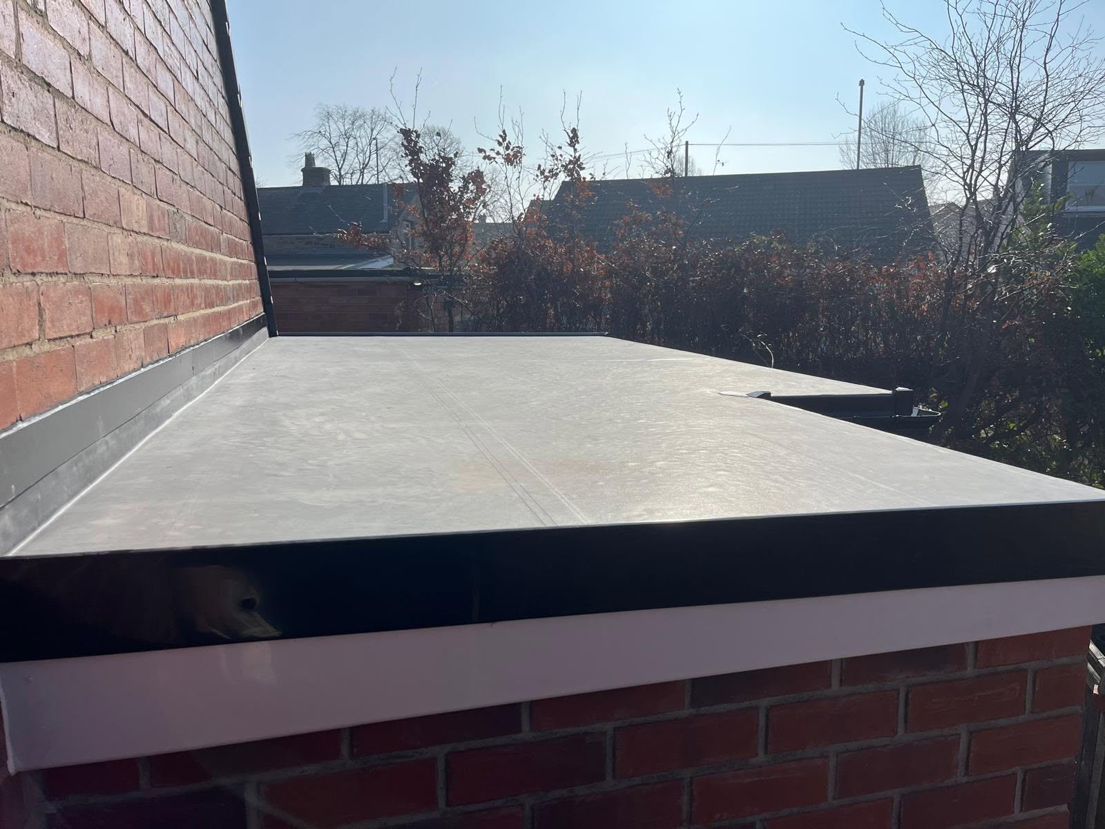 Flat roof installation with professional flashing detail